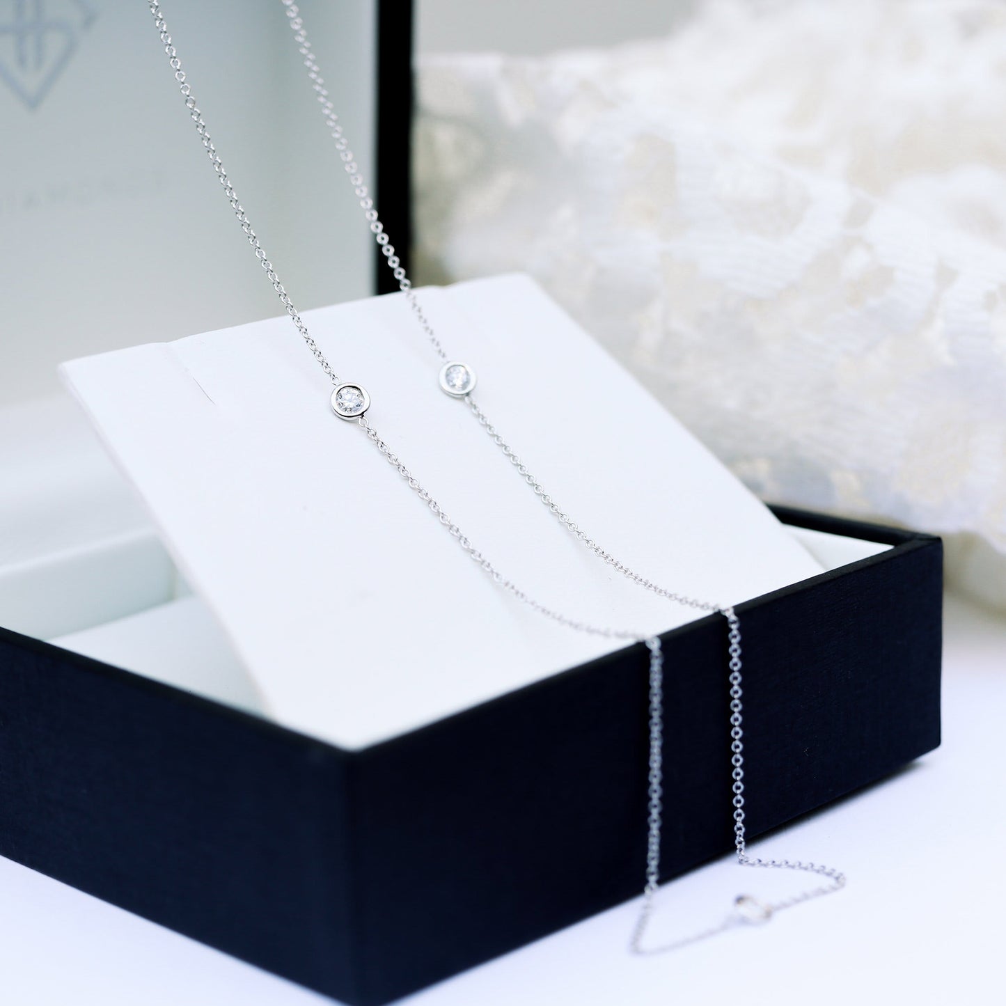 Triple Bezel Necklace with 0.50 TCW Floating Round Cut Moissanite