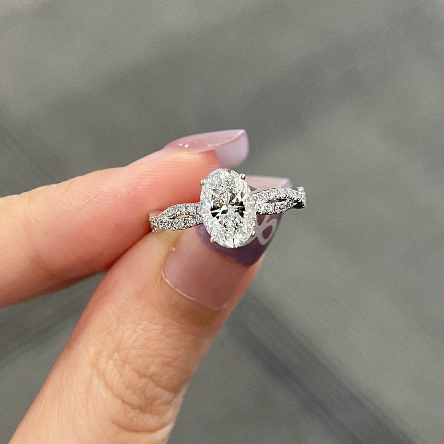 Oval cut CVD diamond twisted engagement ring