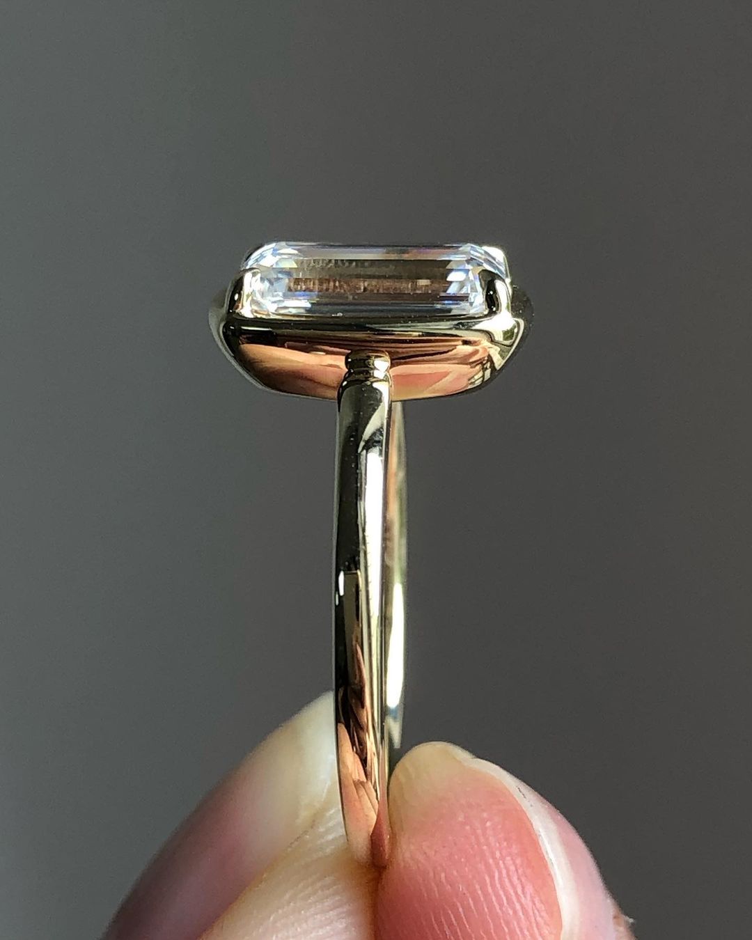 Bezel Solitaire Ring with 3.10 CT Emerald Cut Moissanite