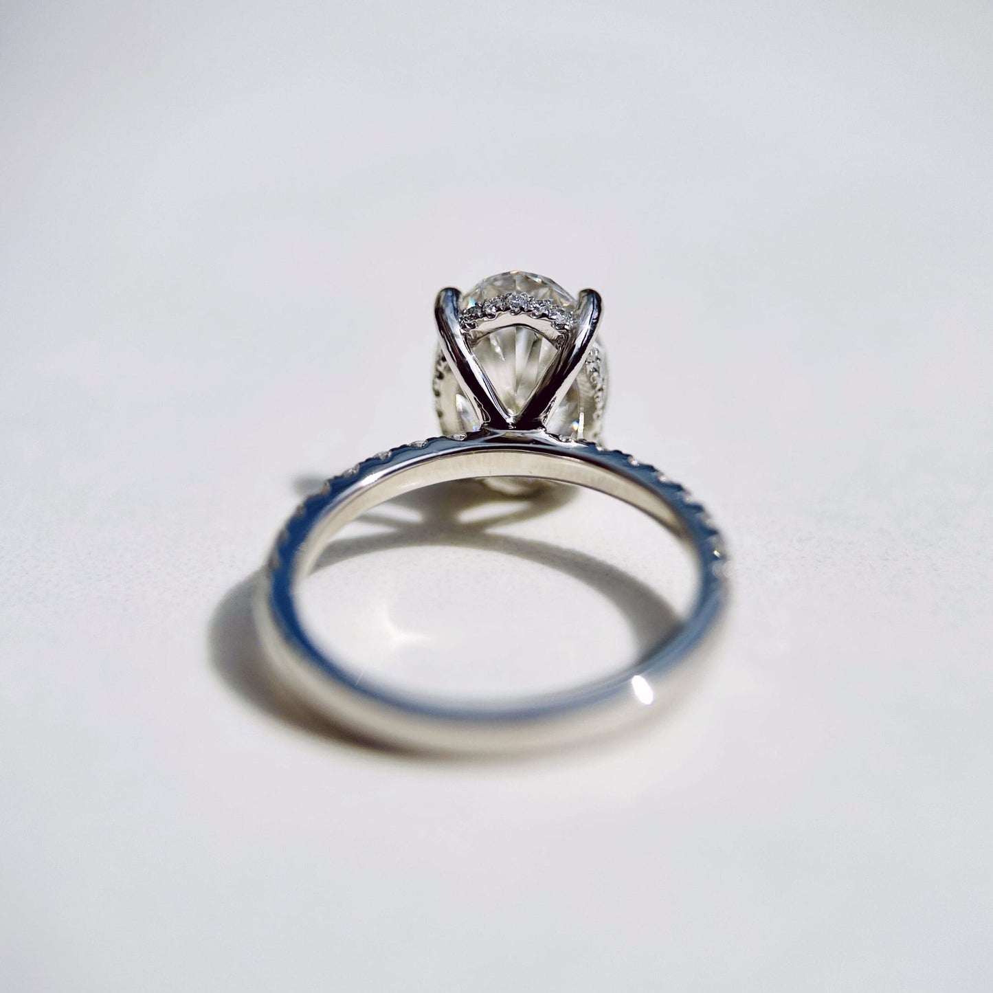 1.80 CT oval cut CVD lab grown diamond engagement ring with hidden halo, pave-set band, E color, VS1 clarity, in white gold setting
