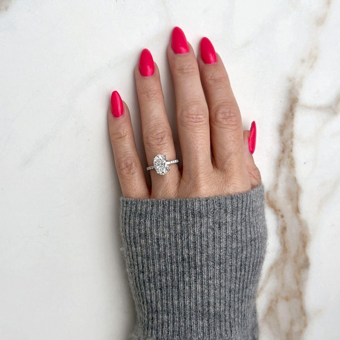 1.80 CT oval cut CVD lab grown diamond engagement ring with hidden halo, pave-set band, E color, VS1 clarity, in white gold setting