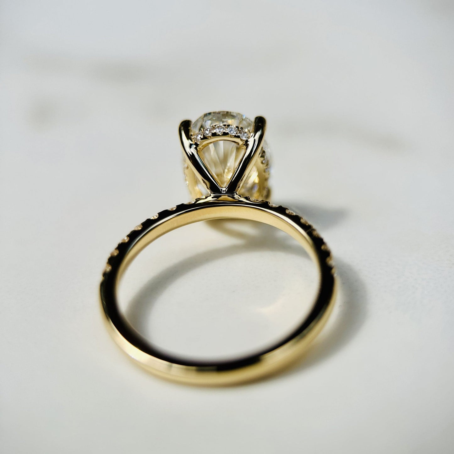 1.80 CT oval cut CVD lab grown diamond engagement ring with hidden halo, pave-set band, E color, VS1 clarity, in white gold setting