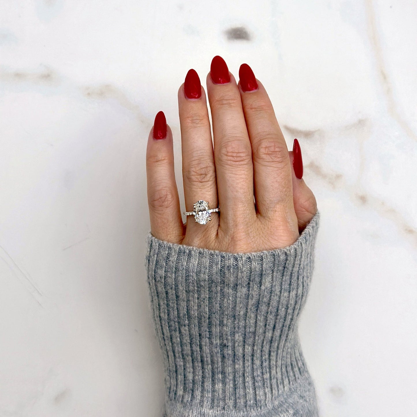 1.80 CT oval cut CVD lab grown diamond engagement ring with hidden halo, pave-set band, E color, VS1 clarity, in white gold setting