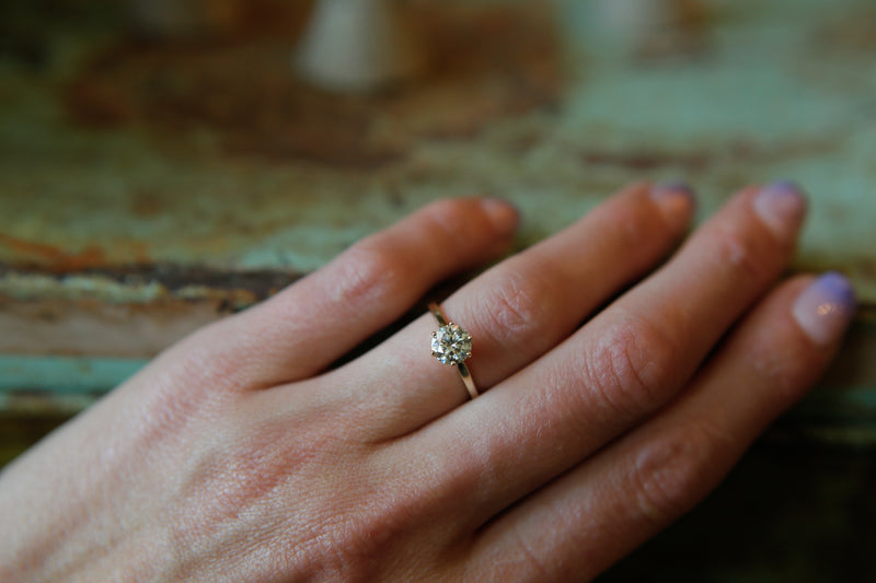 Classic solitaire engagement ring with round cut moissanite stone