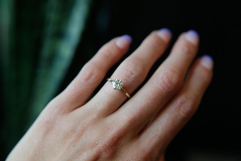 Classic solitaire engagement ring with round cut moissanite stone