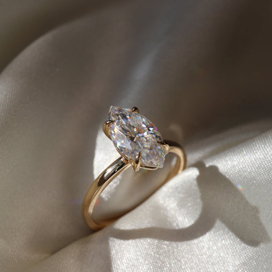 Classic solitaire ring with marquise-cut moissanite center stone