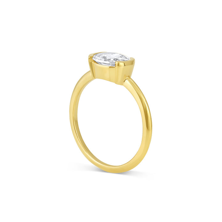 Half bezel oval moissanite solitaire engagement ring