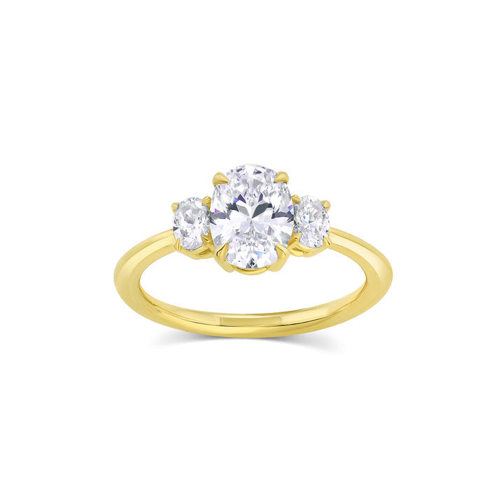 Three stone engagement ring with oval cut moissanite