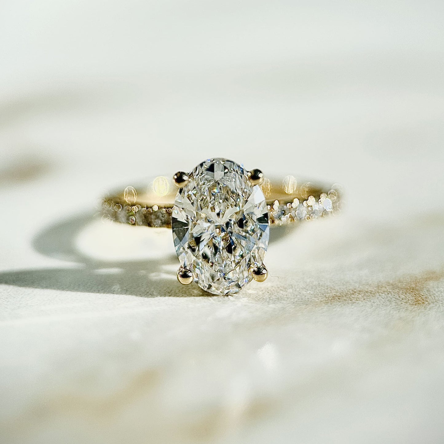 1.80 CT oval cut CVD lab grown diamond engagement ring with hidden halo, pave-set band, E color, VS1 clarity, in white gold setting