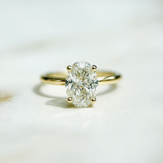 1.50 CT oval cut CVD lab grown diamond engagement ring with hidden halo design, E color, VS1 clarity, on a polished white gold band