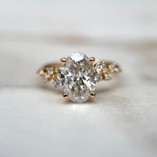 1.80 CT oval cut CVD lab grown diamond cluster engagement ring with E color, VS1 clarity, in white gold setting with floral-style arrangement