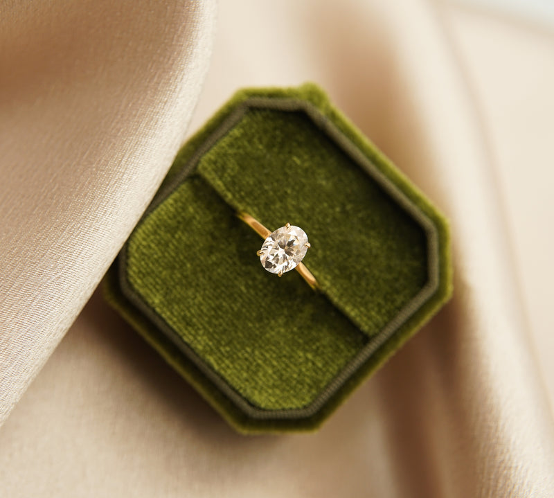 Solitaire engagement ring with oval cut moissanite stone