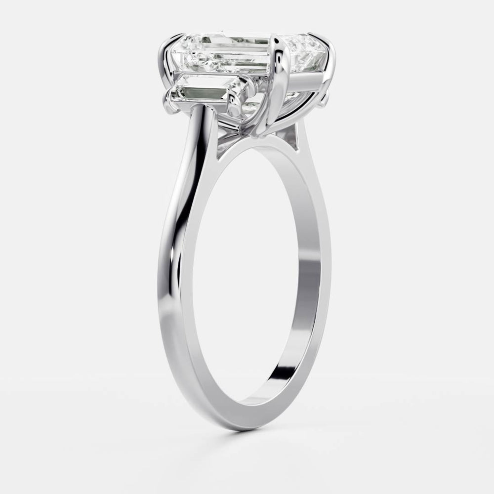 Three stone emerald moissanite engagement ring