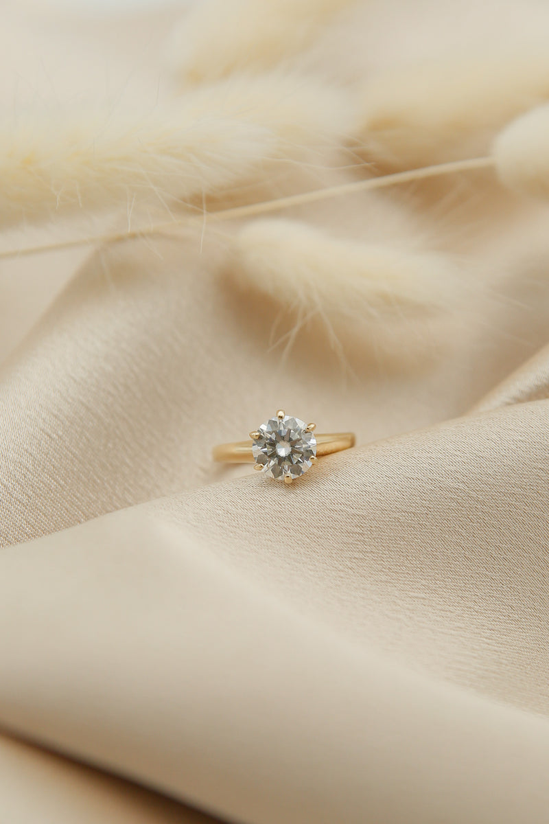 Round cut moissanite solitaire engagement ring