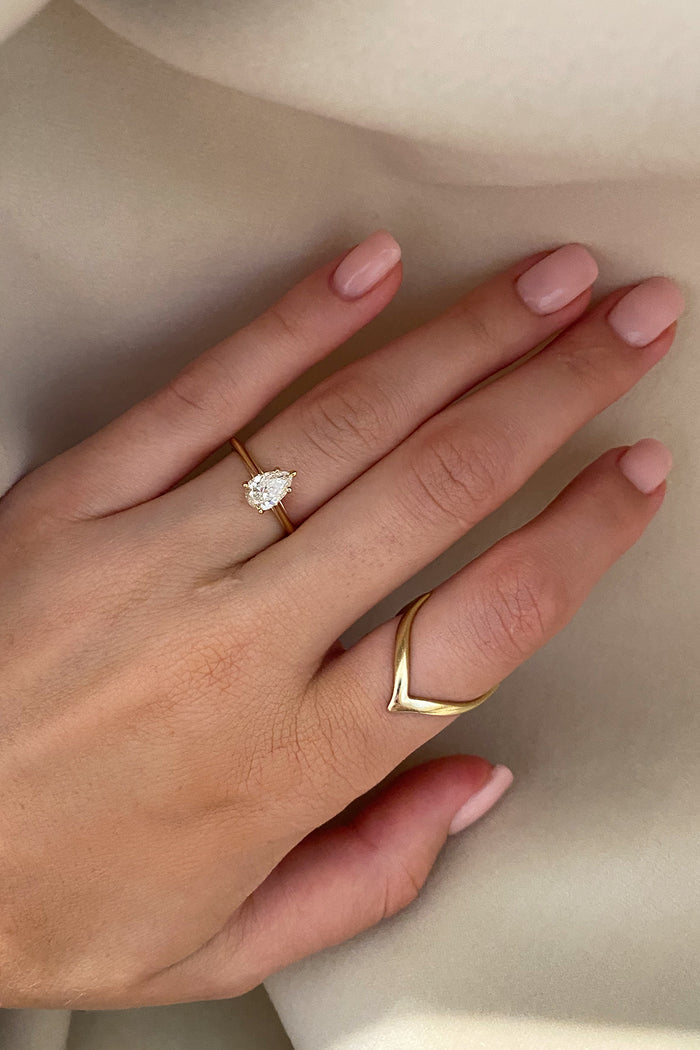 Solitaire Ring with 1.0 CT Pear Cut Moissanite