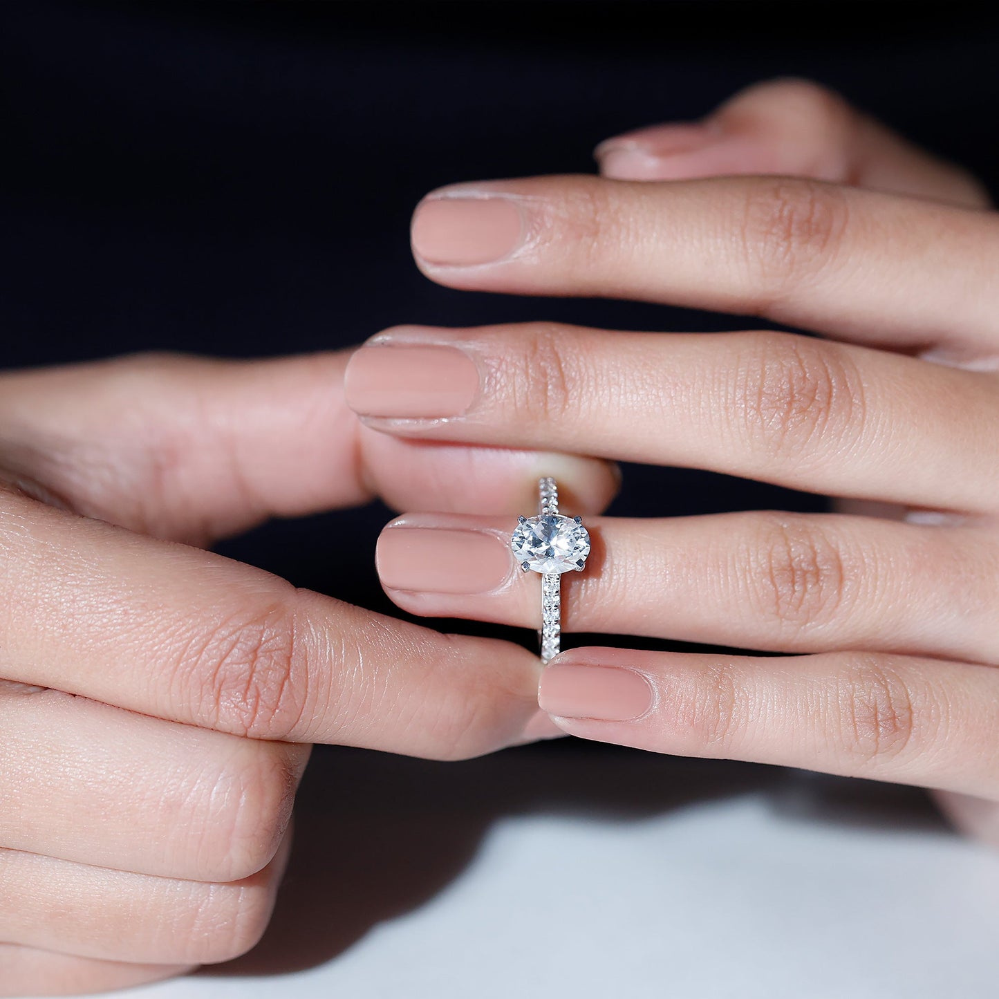 Oval cut moissanite engagement ring with pavé band setting