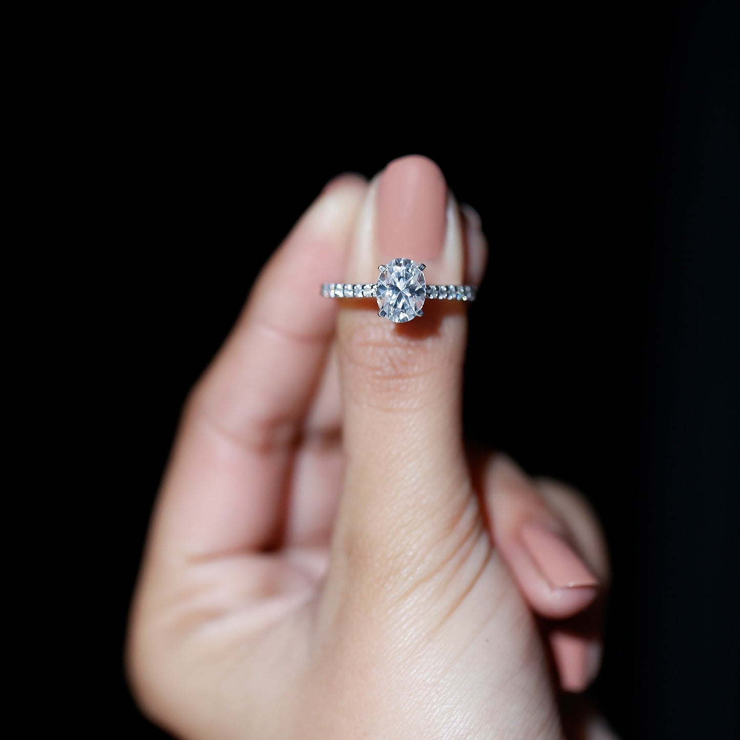 Oval cut moissanite engagement ring with pavé band setting