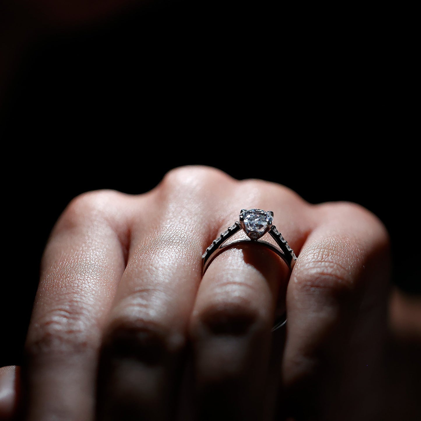 Oval cut moissanite engagement ring with pavé band setting