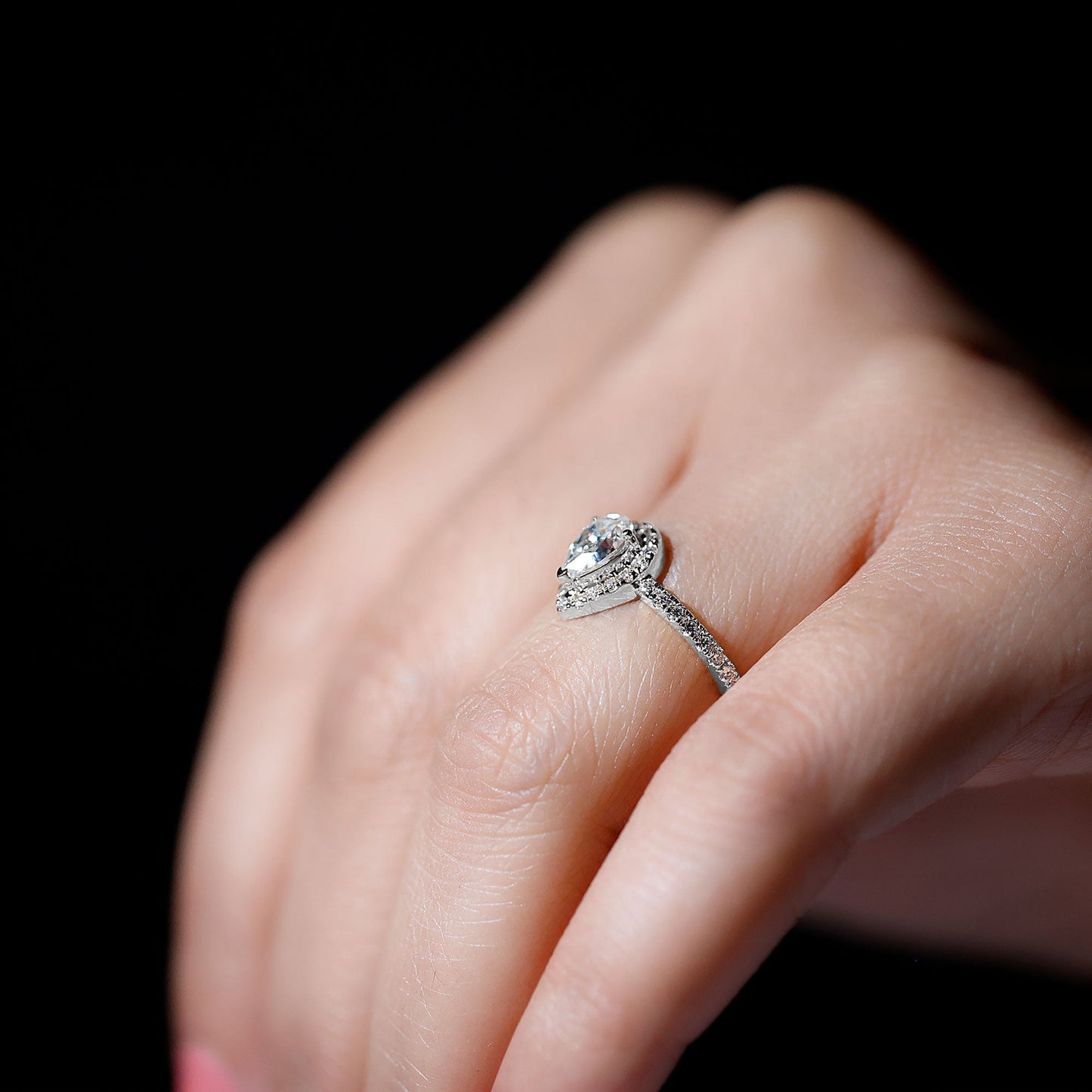 Halo & Pave Ring with 1.25 CT Pear Cut Moissanite