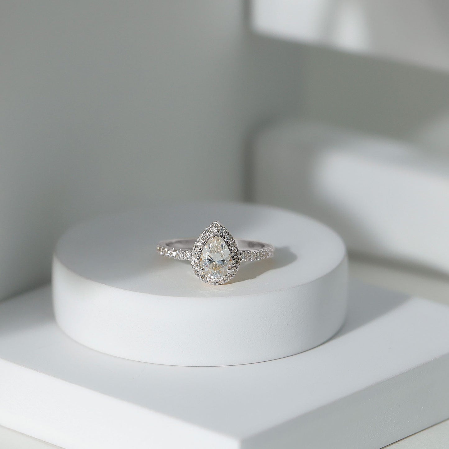 Halo & Pave Ring with 1.25 CT Pear Cut Moissanite