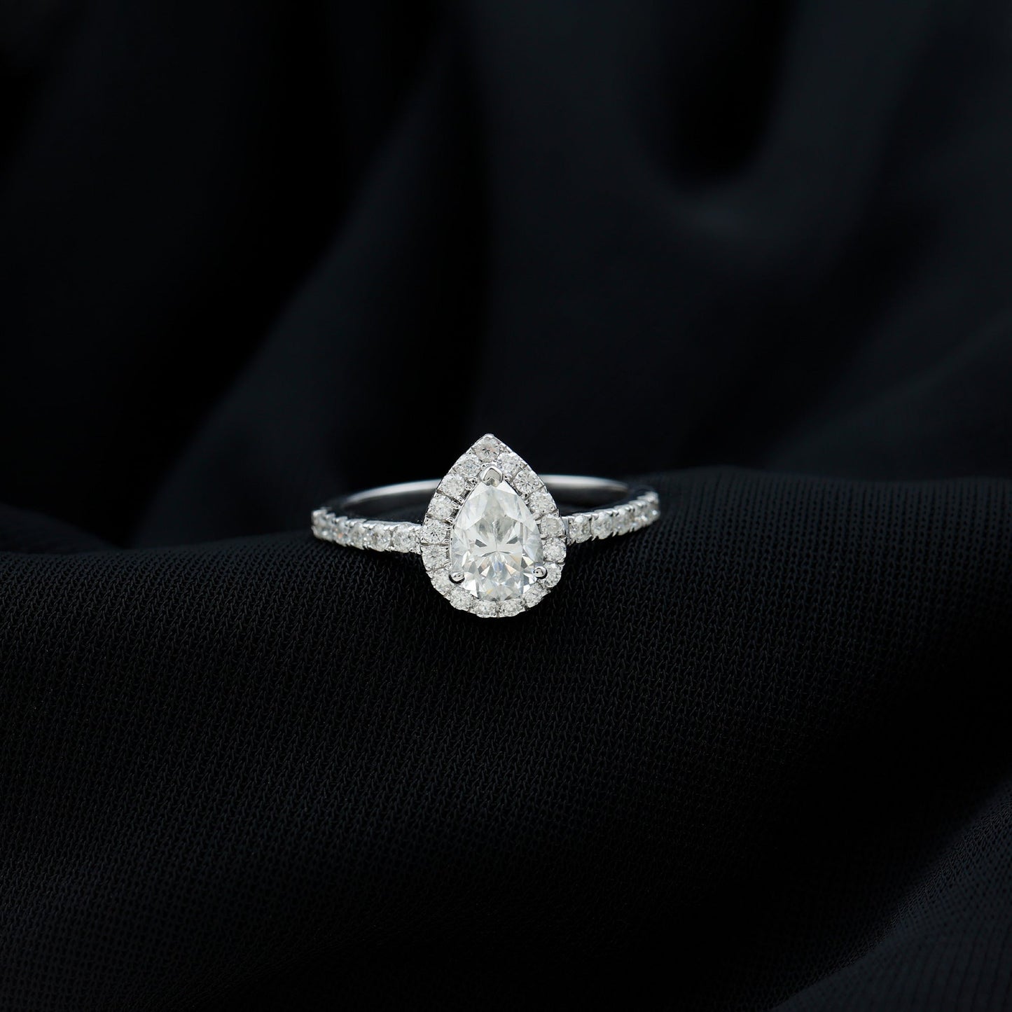 Halo & Pave Ring with 1.25 CT Pear Cut Moissanite