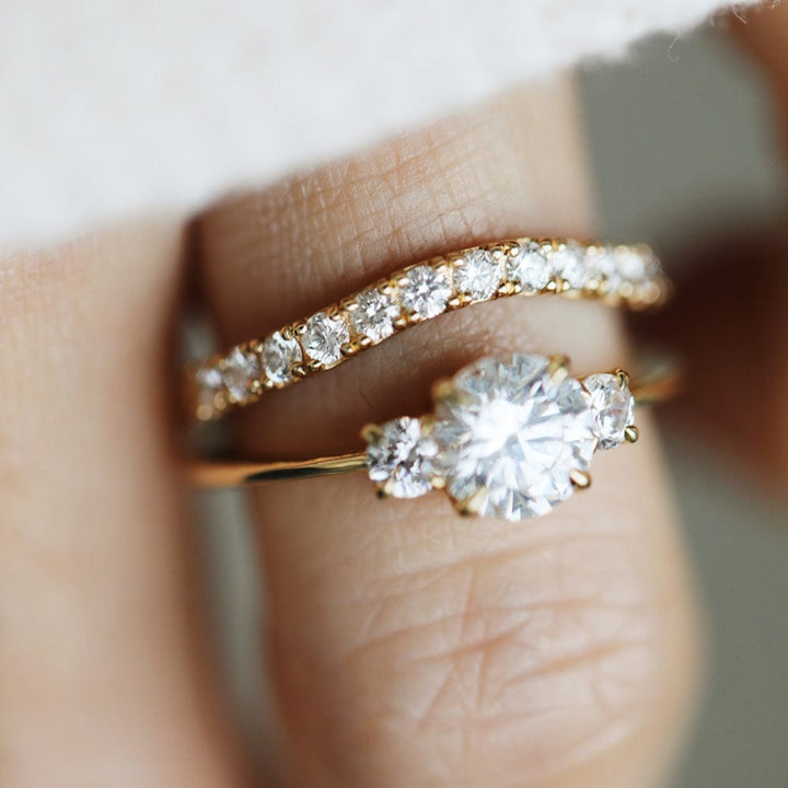 Three stone engagement ring with round cut moissanite