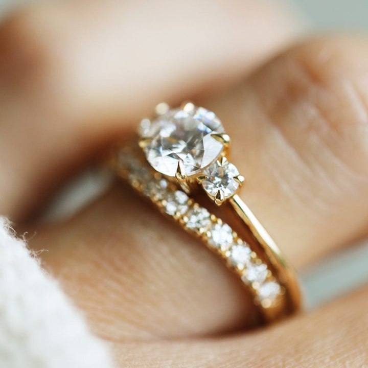 Three stone engagement ring with round cut moissanite