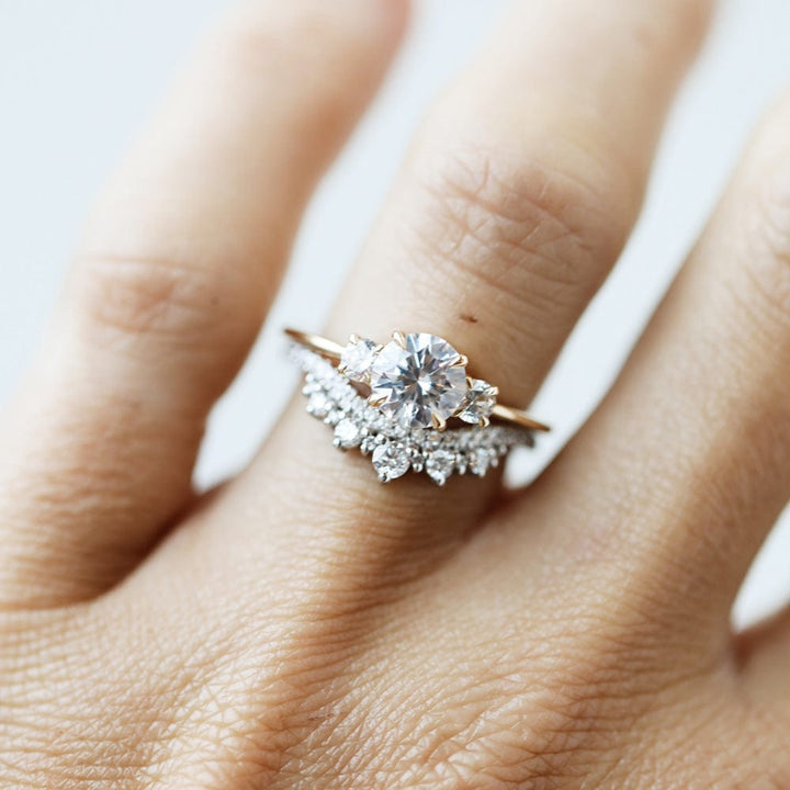 Three stone engagement ring with round cut moissanite