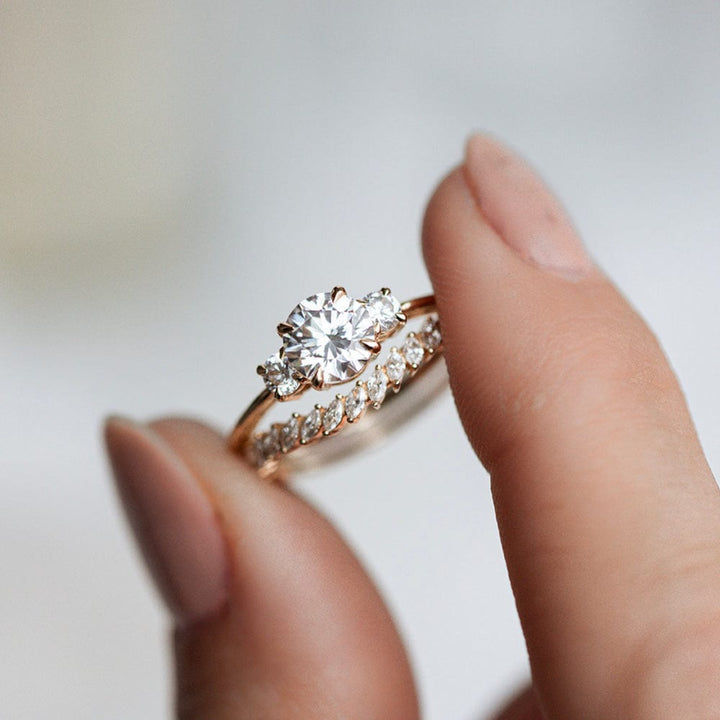 Three stone engagement ring with round cut moissanite