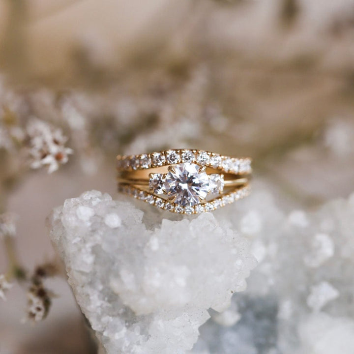 Three stone engagement ring with round cut moissanite