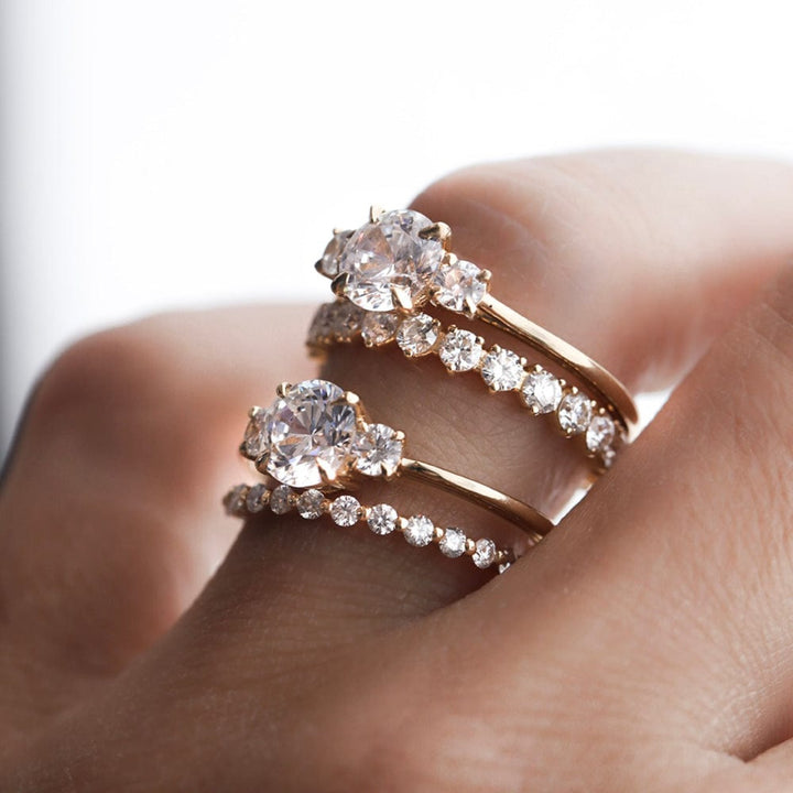 Three stone engagement ring with round cut moissanite