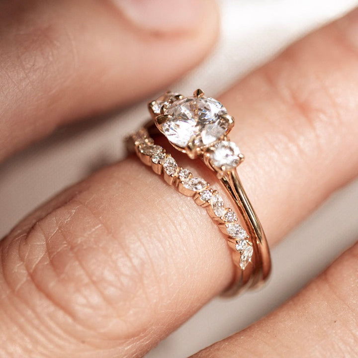 Three stone engagement ring with round cut moissanite