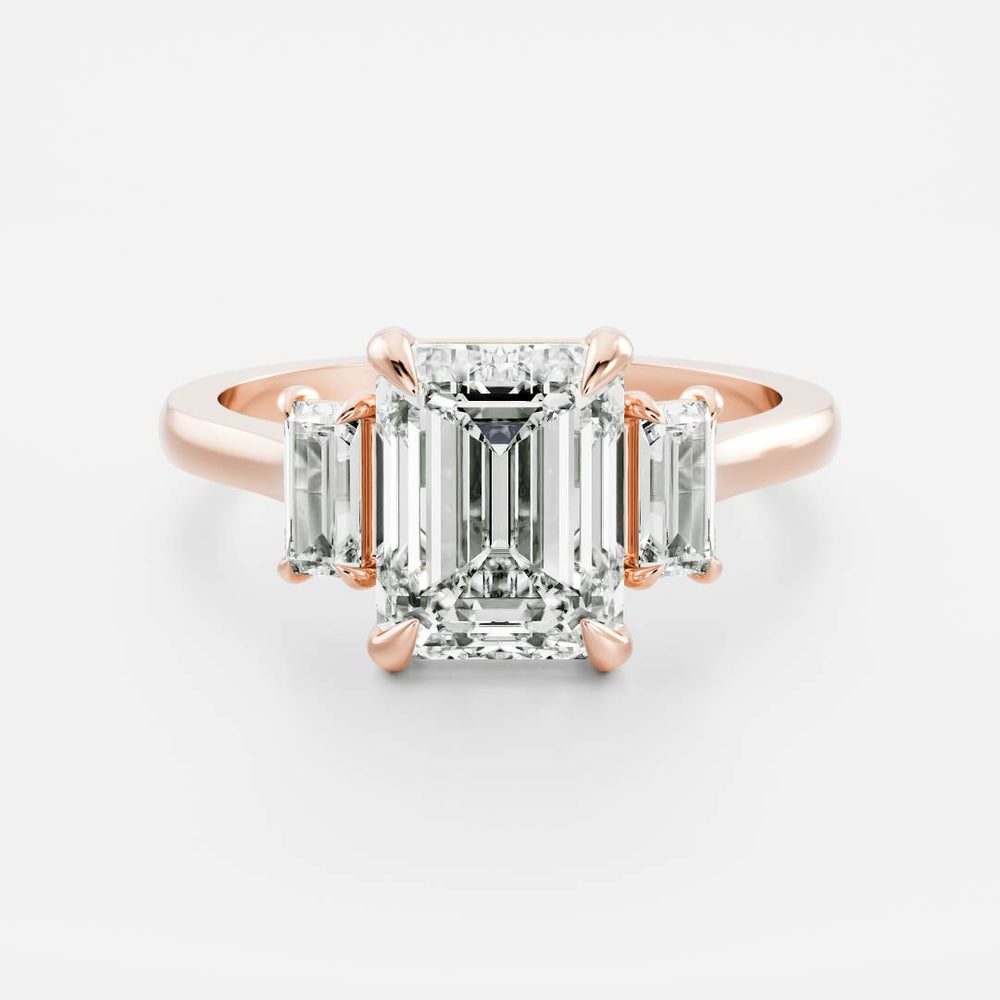 Three stone emerald moissanite engagement ring