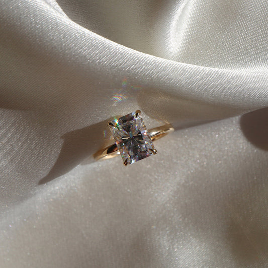 Radiant moissanite solitaire engagement ring in classic setting