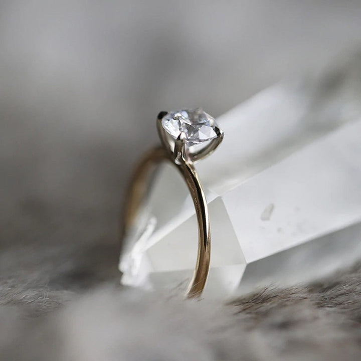 Round moissanite solitaire engagement ring in classic setting