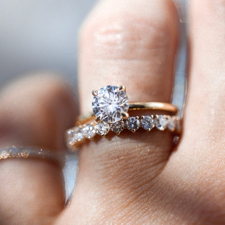 Round moissanite solitaire engagement ring in classic setting