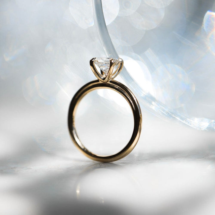 Round moissanite solitaire engagement ring in classic setting