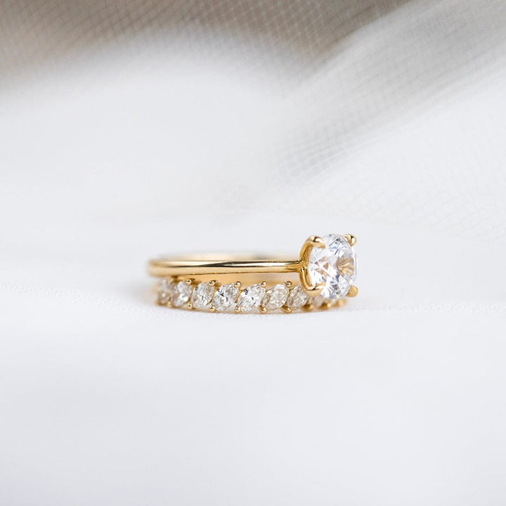 Round moissanite solitaire engagement ring in classic setting