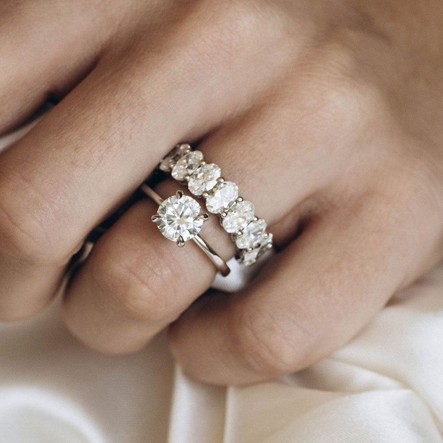 Round moissanite solitaire engagement ring in classic setting