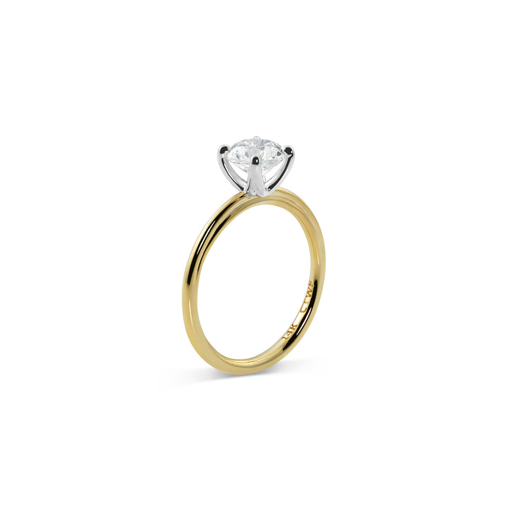 Round moissanite solitaire engagement ring in classic setting