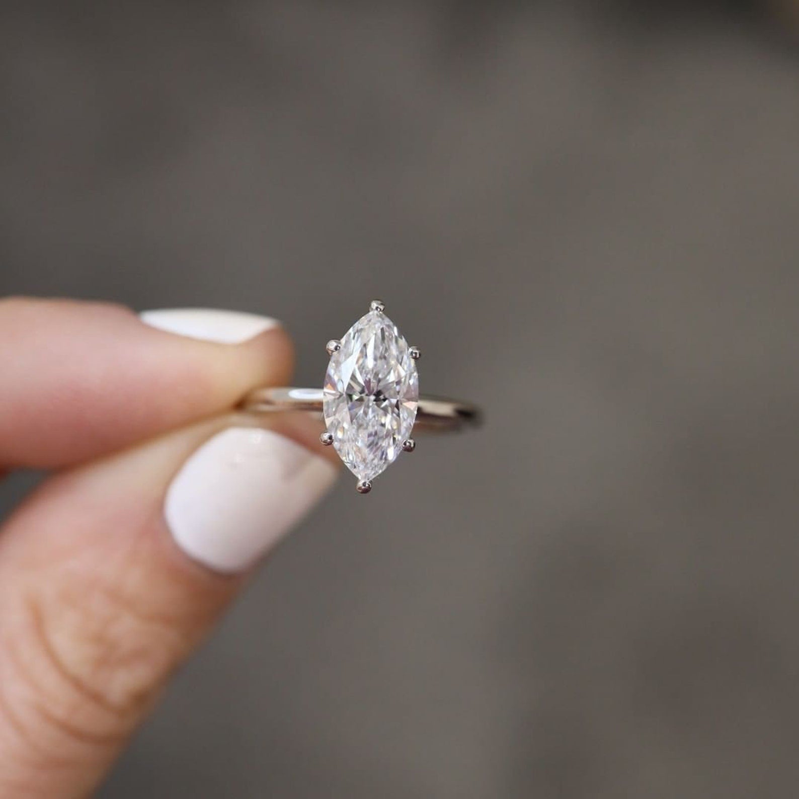 Marquise cut moissanite solitaire engagement ring in classic style