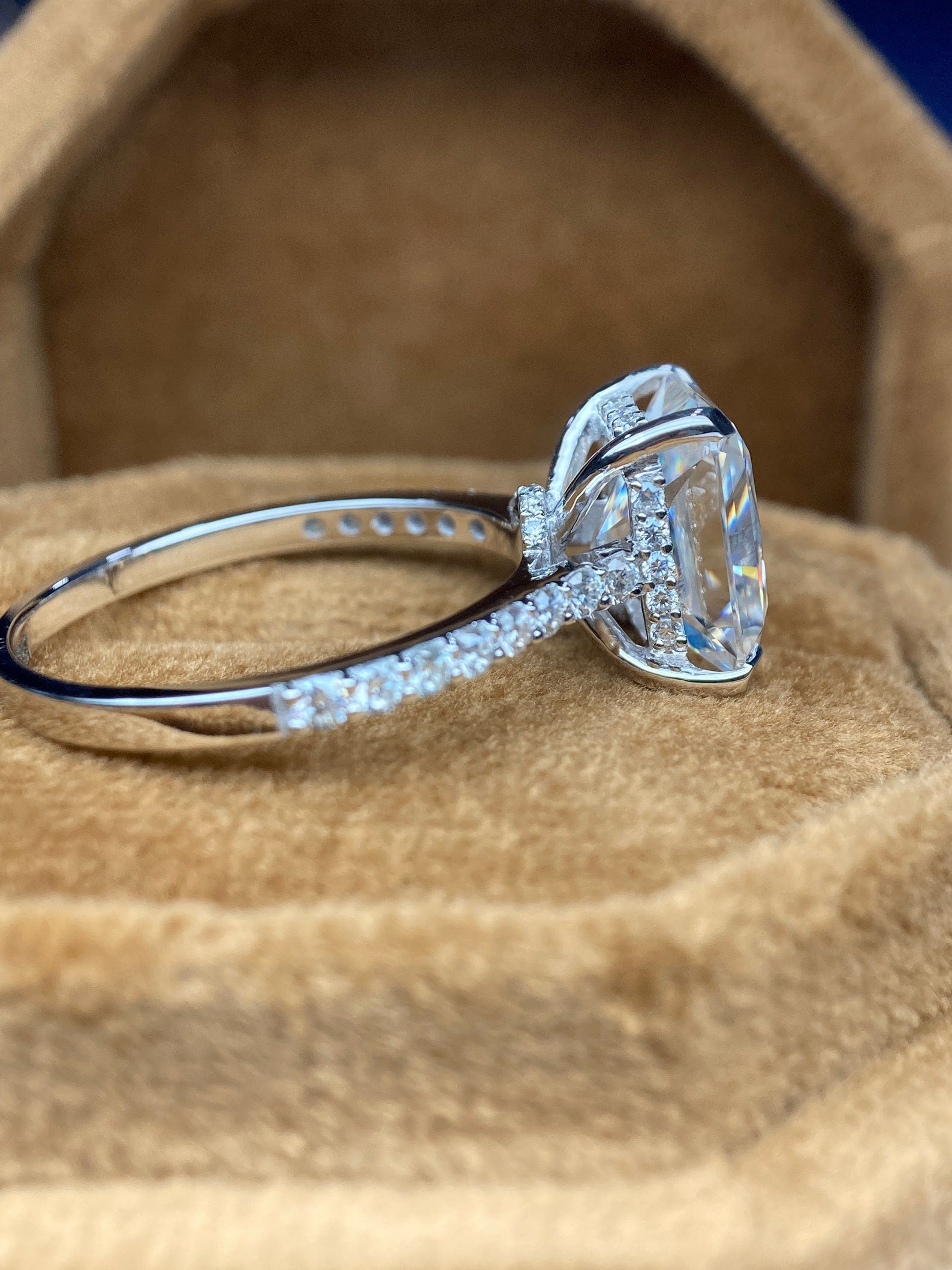 Radiant cut moissanite engagement ring with hidden halo design