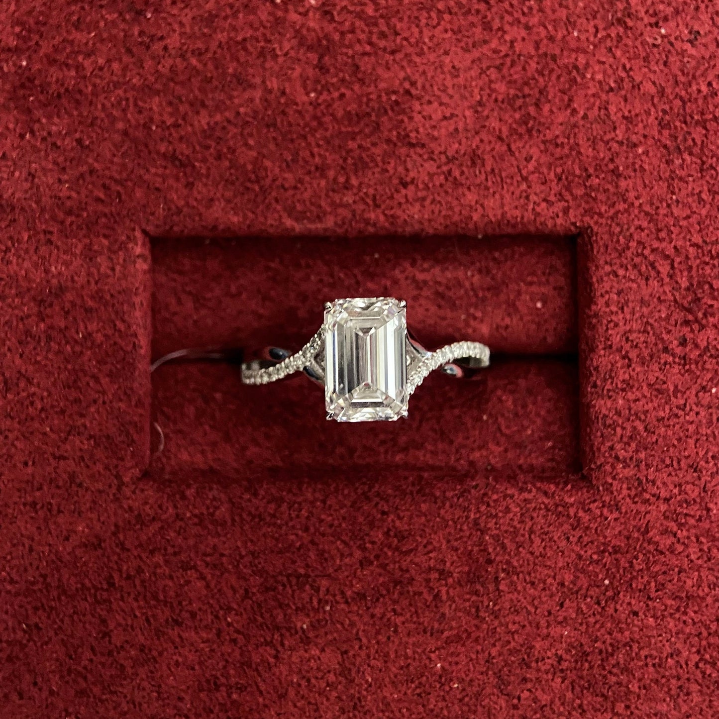 Emerald cut CVD diamond twisted style engagement ring