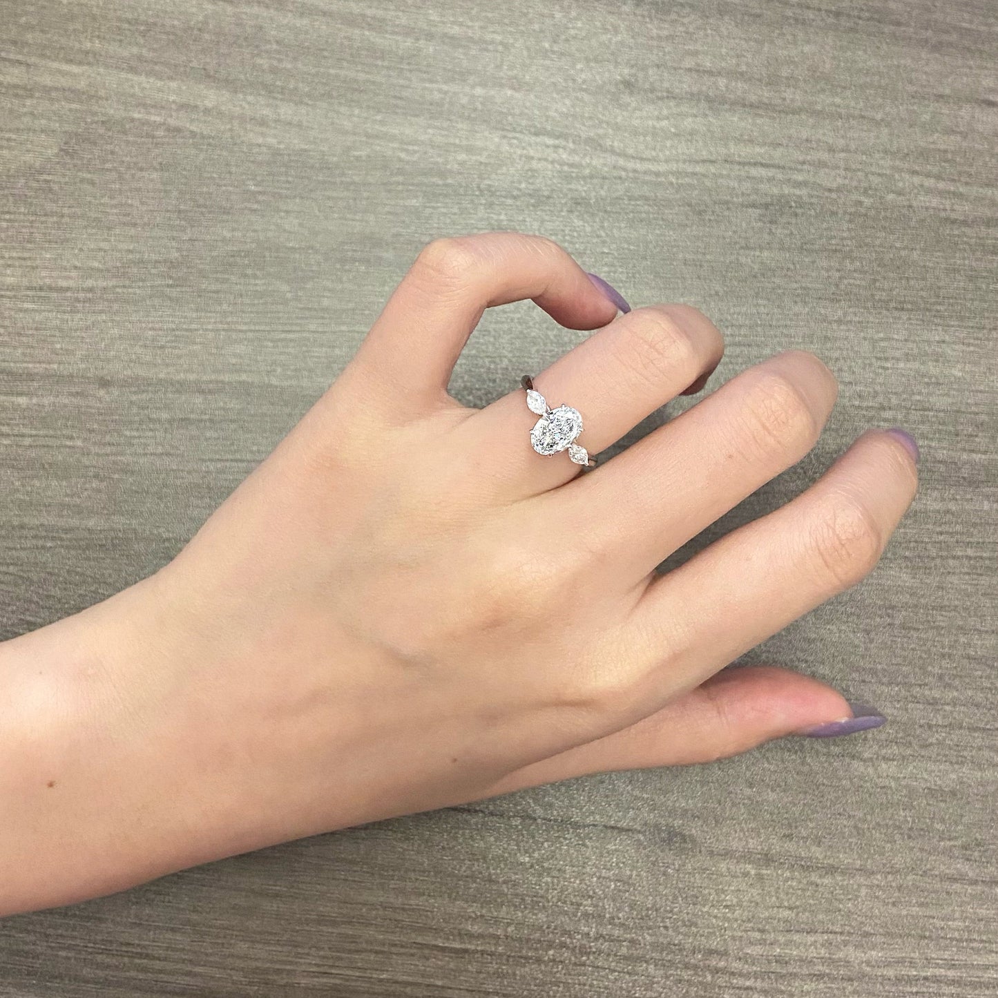 Oval cut CVD diamond three stone style engagement ring