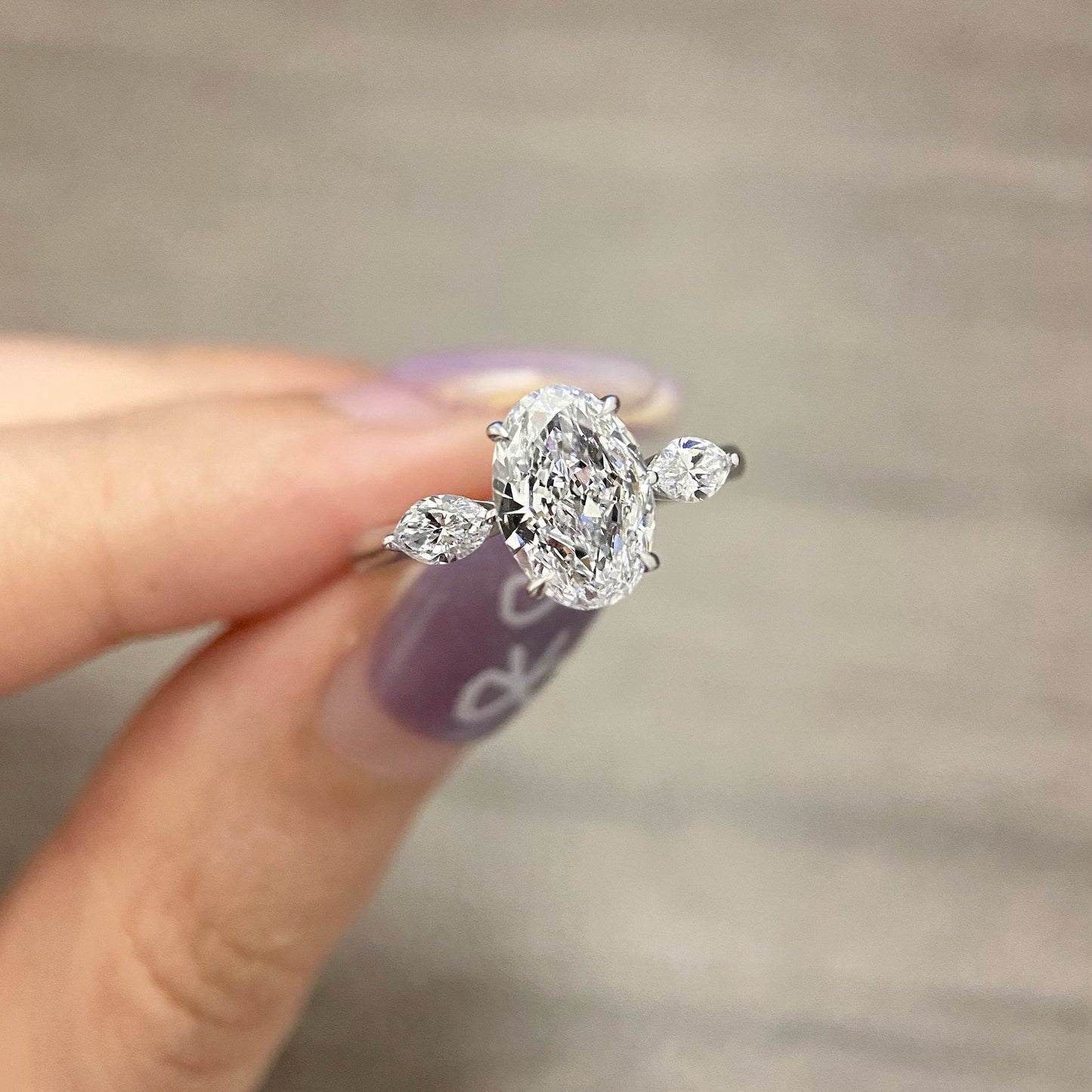Oval cut CVD diamond three stone style engagement ring