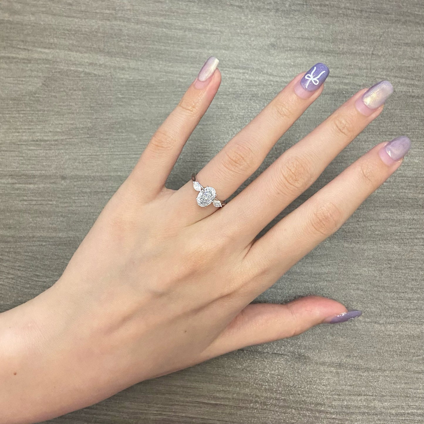 Oval cut CVD diamond three stone style engagement ring