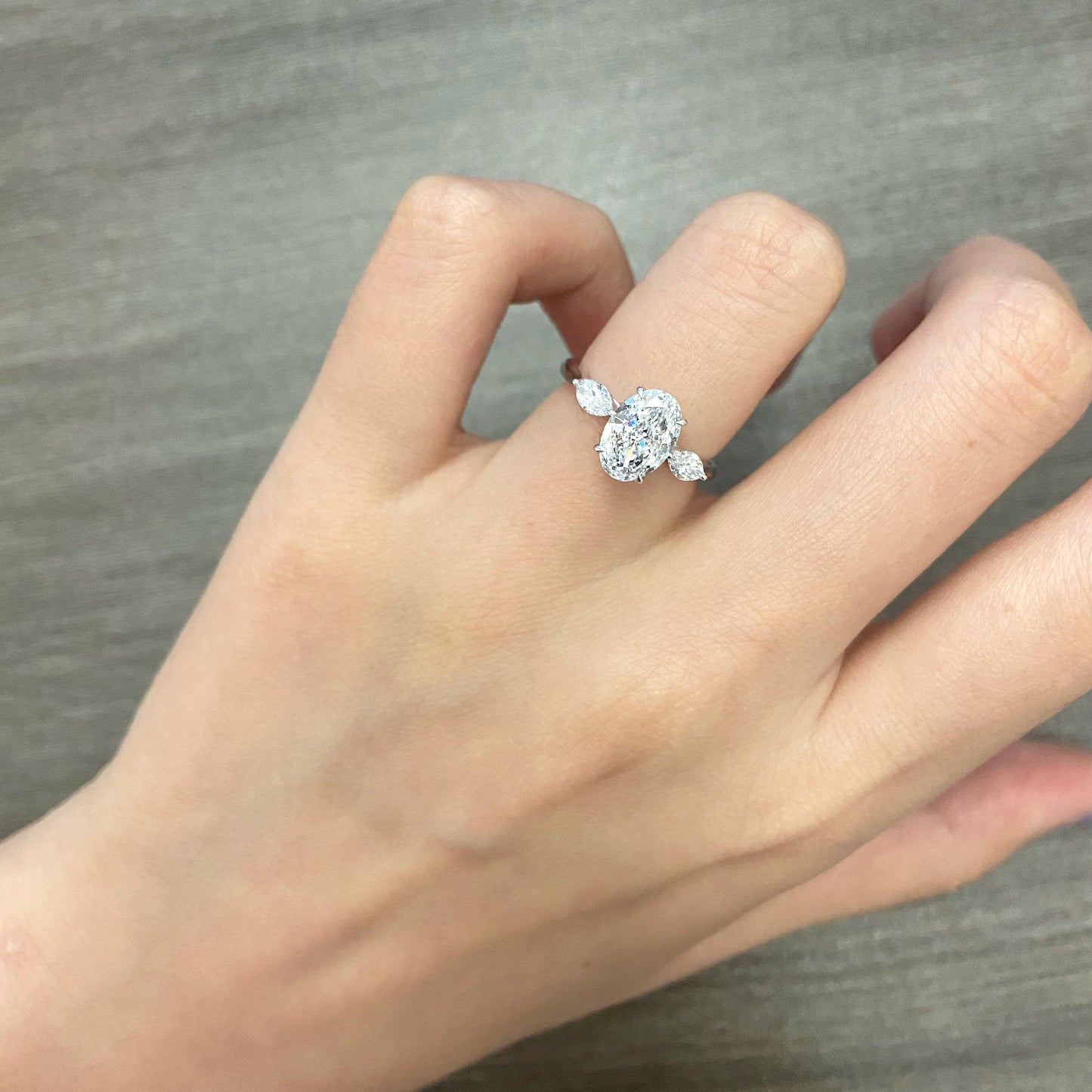 Oval cut CVD diamond three stone style engagement ring