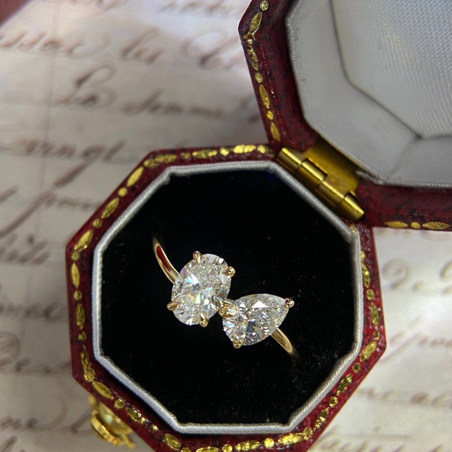 Oval and pear cut CVD diamond two stone style engagement ring