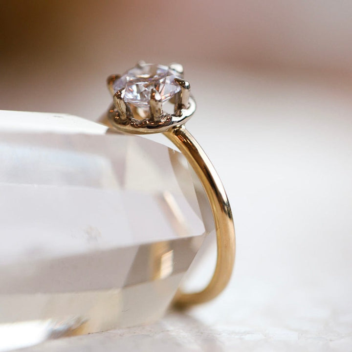 Solitaire engagement ring with round cut moissanite stone