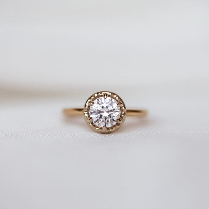 Solitaire engagement ring with round cut moissanite stone